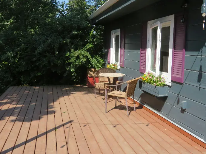 a patio with a table and chairs on it
