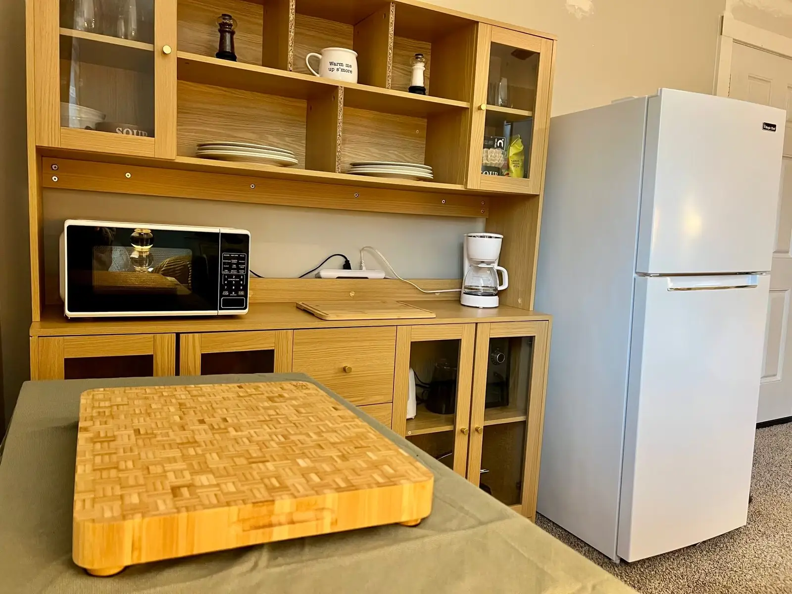 Kitchenette counter, microwave and refrigerator wiped down and ready for arriving guests in Carrollton, GA