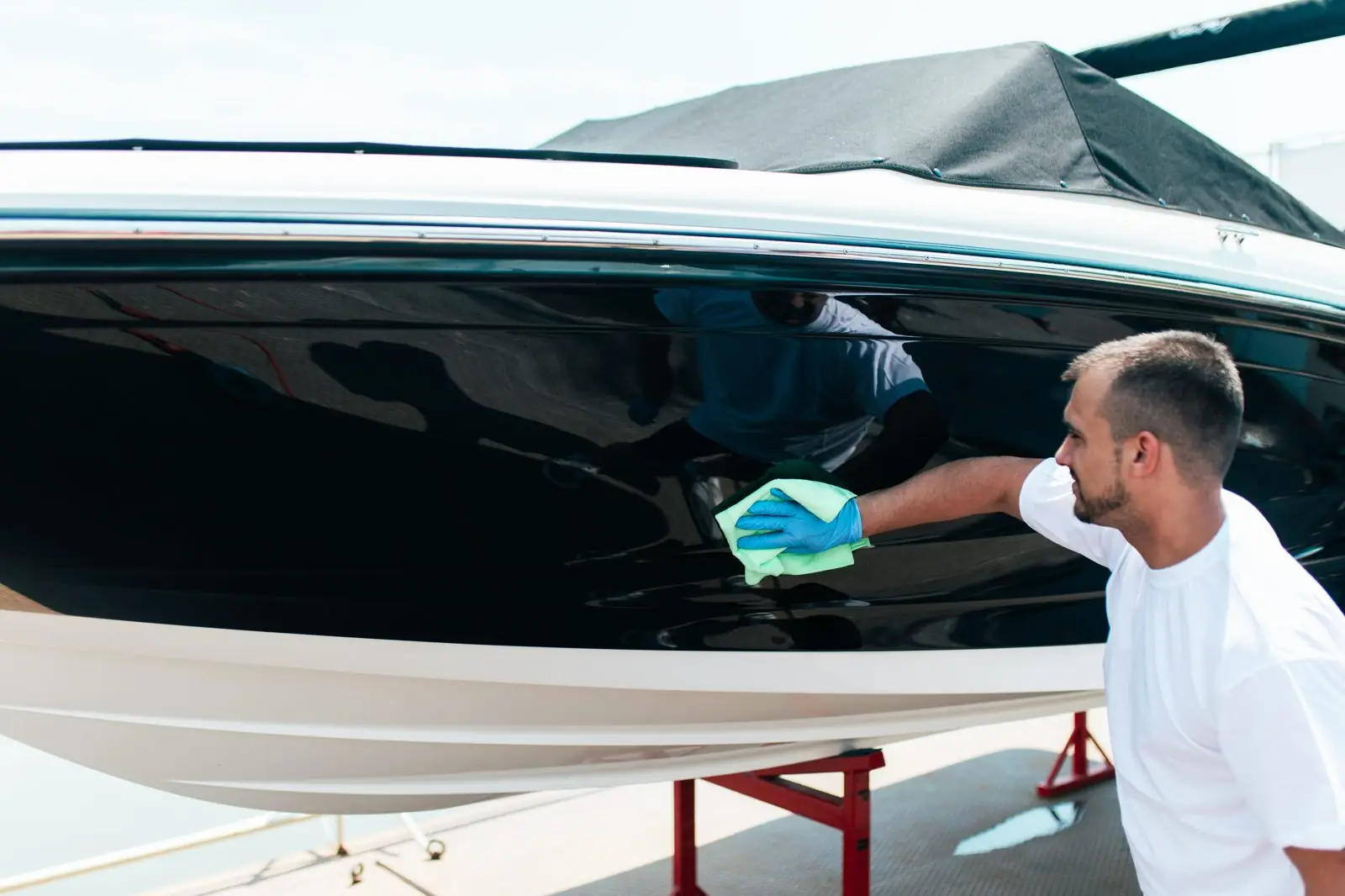 Boat hull being hand washed at the dock in Carrollton, GA
