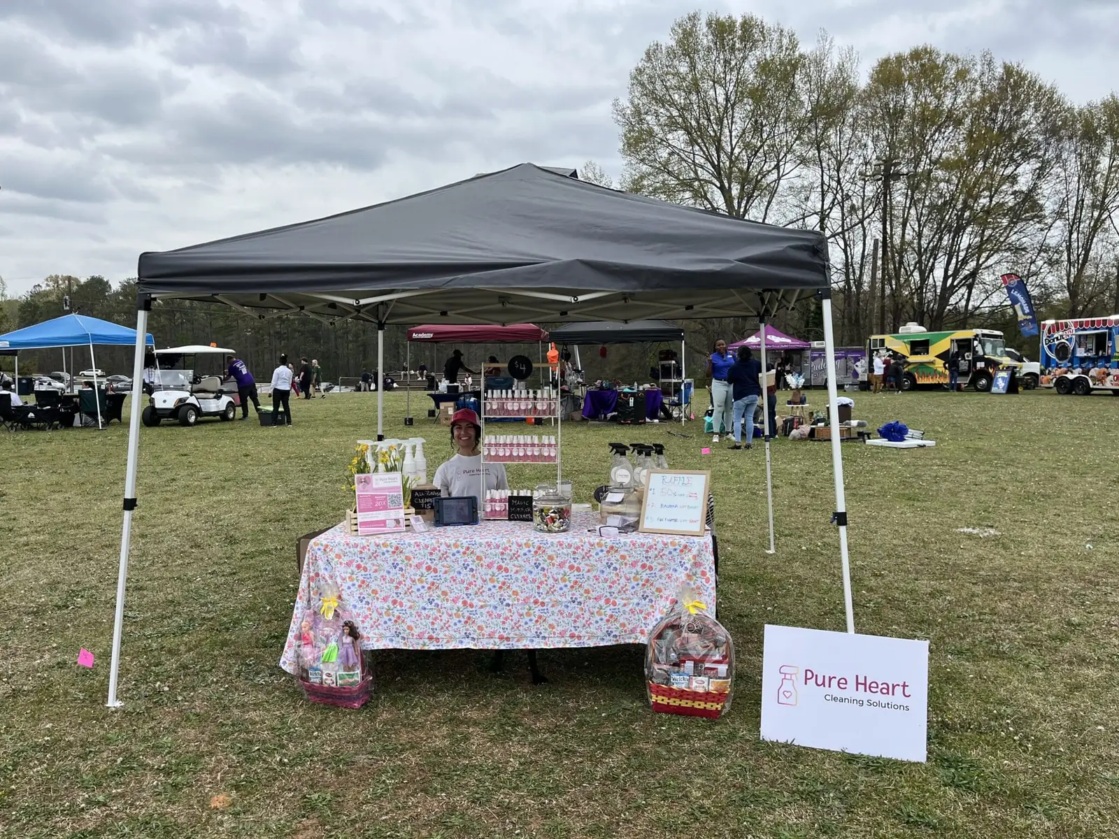 Pure Heart Cleaning Solutions booth at a local community event