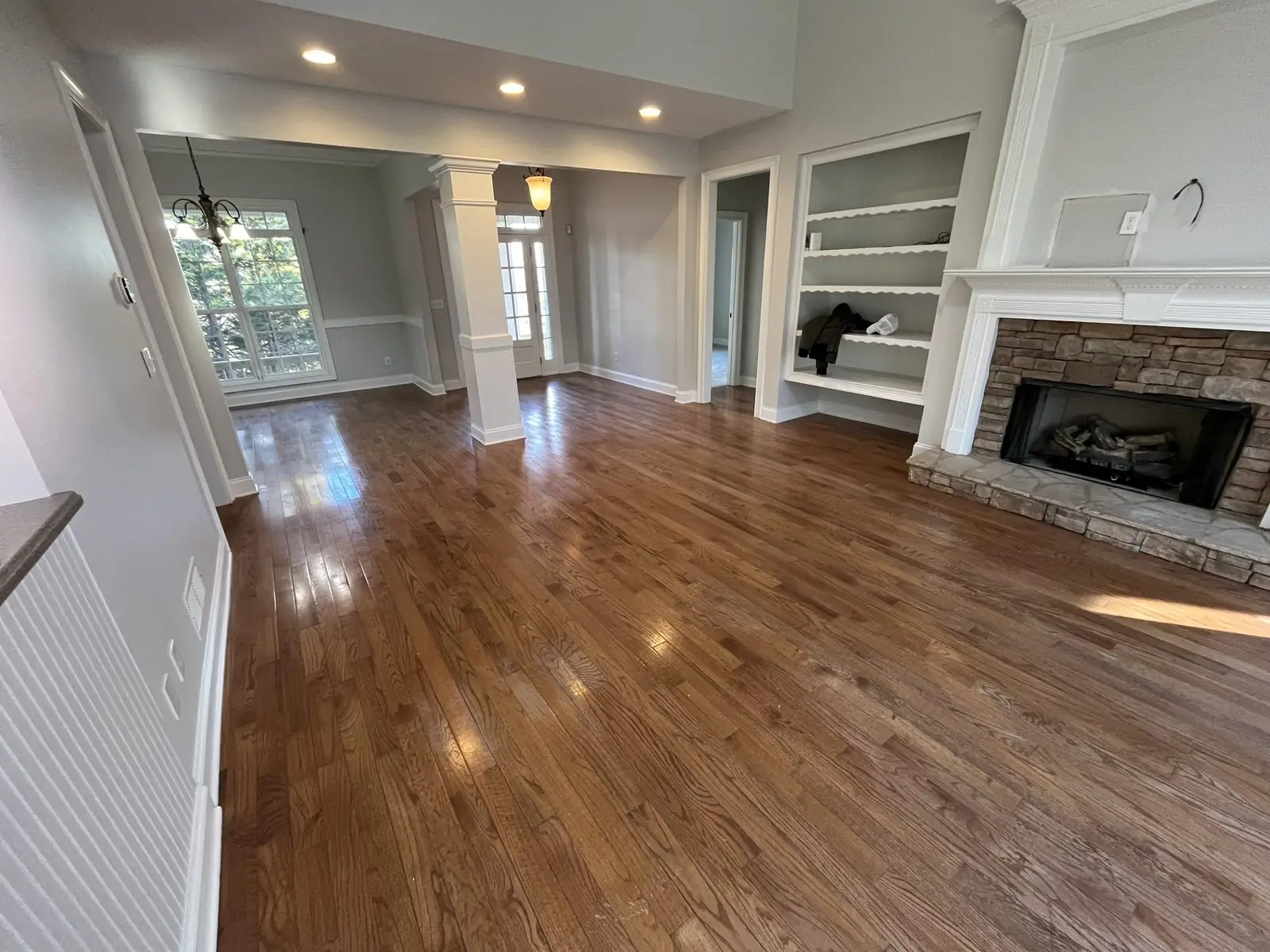 Freshly cleaned living room with hardwood floors