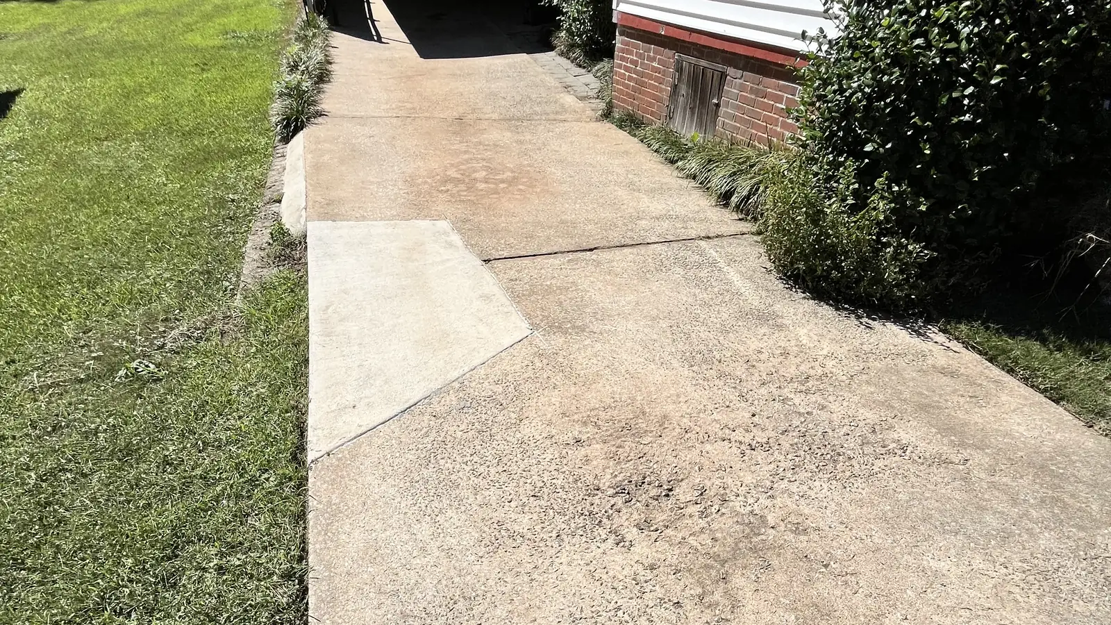 Concrete driveway pressure washed by Pure Heart Cleaning Solutions in Carrollton, GA