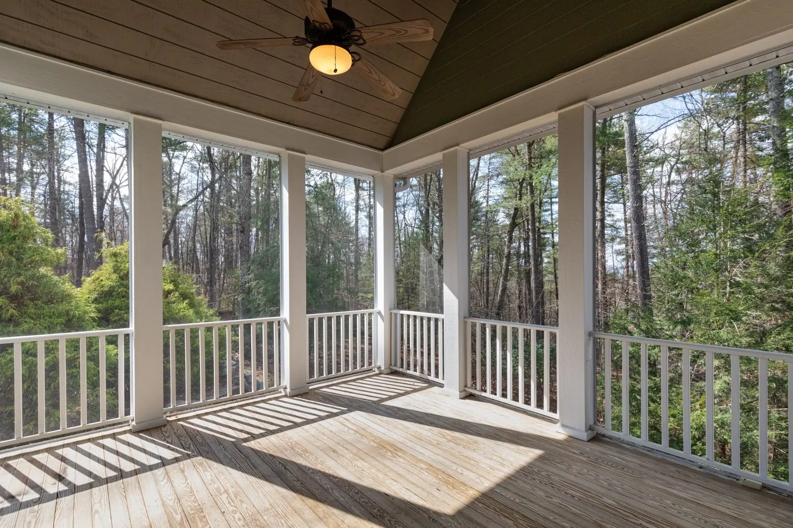 Screened lanai with a clean floor and railings in Carrollton, GA