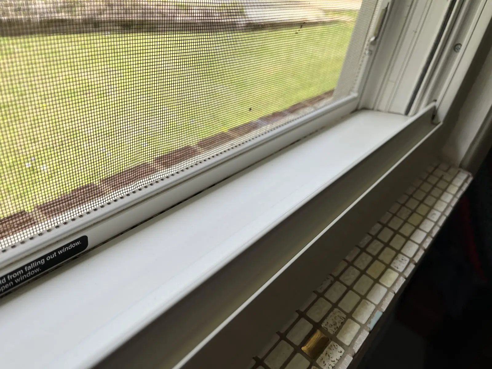 The same window sill and track wiped clean in Carrollton, GA