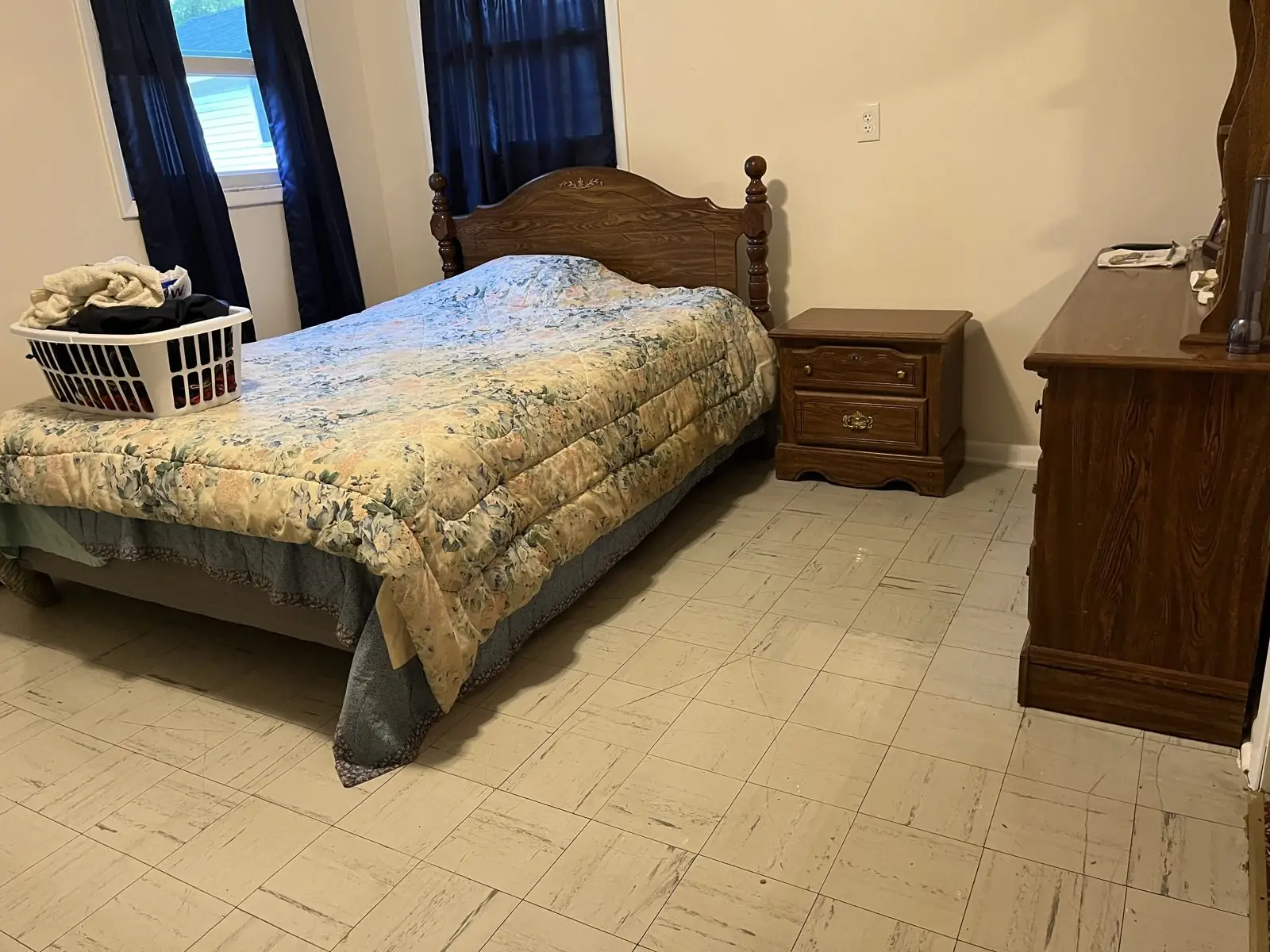 Bedroom with laundry piled on the bed before cleaning in Carrollton, GA
