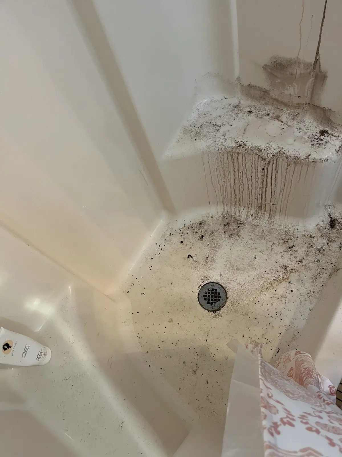 Shower pan with soap scum and buildup before a deep clean in Carrollton, GA