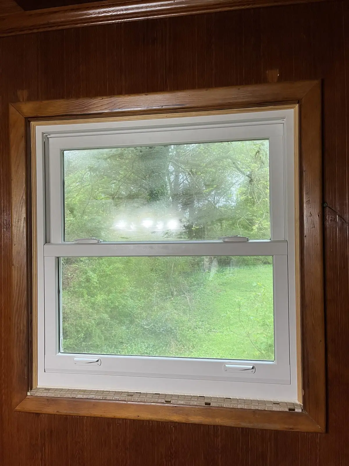 Window glass clouded with grime before cleaning in Carrollton, GA
